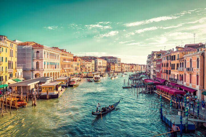 A canal in Venice with a boat