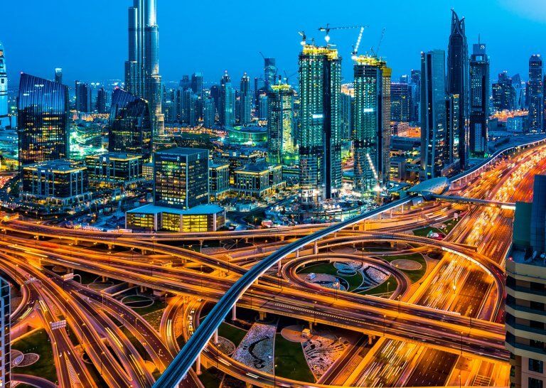 Aerial view of Dubai Downtown District overlooking busy Shaikh Zayed Road, Burj Khalifa and Modern Skyline