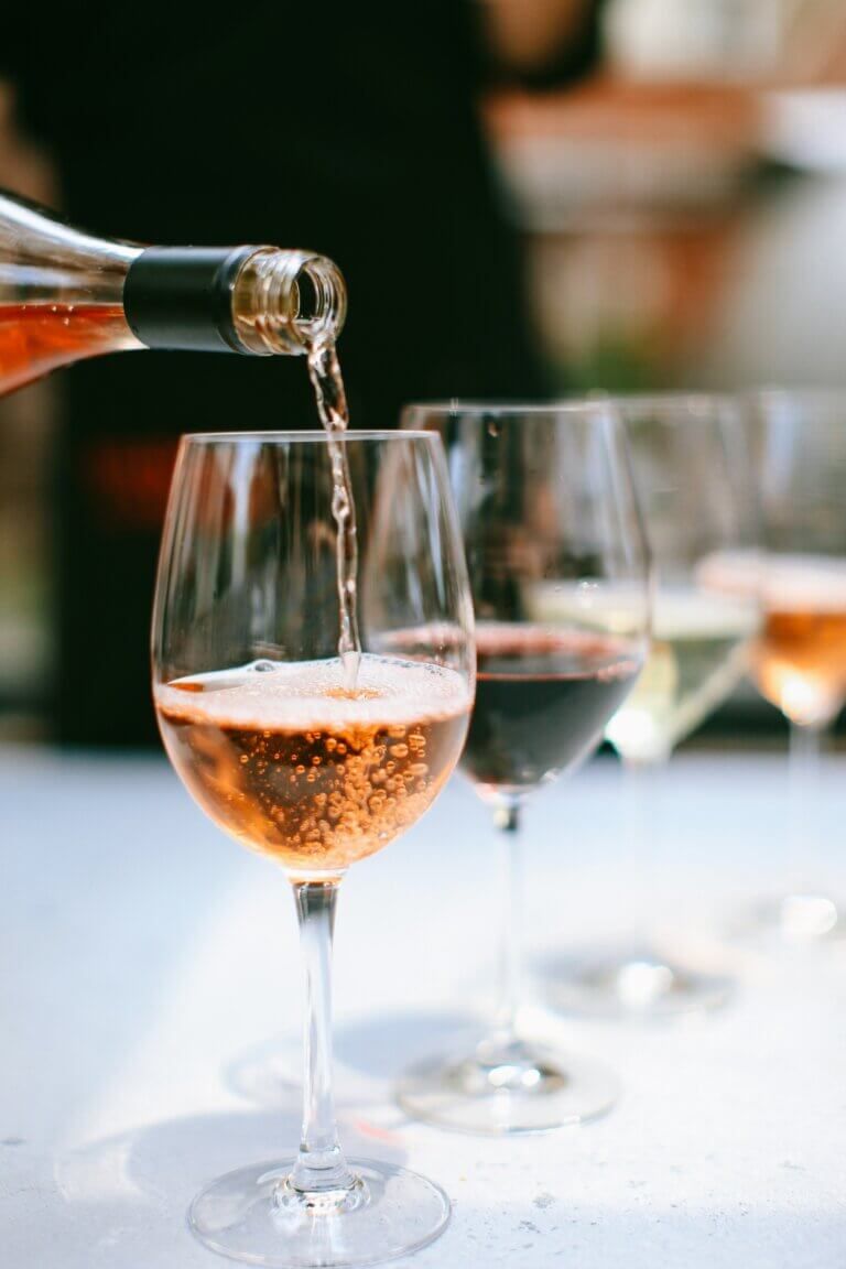 Rose being poured into a wine glass.