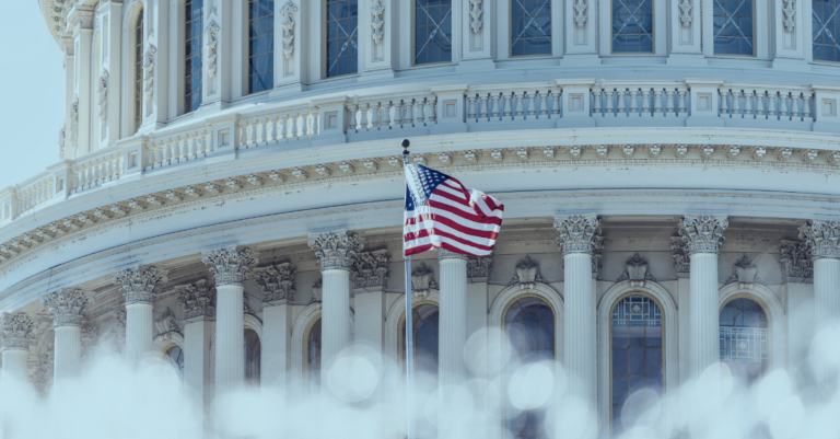 US Congress dome with American flag flying